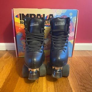 Impala Quad skate rollerskates. Excellent condition. Like New! Black Size 7.